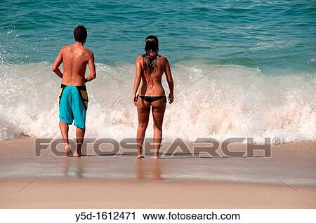 young couple in the water of Atlantic ocean, beach in Foz do Arelho, Slver Coast, Leiria district, Portugal, middle of October View Large Photo Image Stock Image - young couple in the water of Atlantic ocean, beach in Foz do Arelho, Slver Coast, Leiria district, Portugal, middle of October. Fotosearch