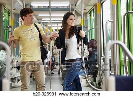 Stock Image - Young couple in tram, Vitoria, Alava, Basque Country, Spain. Fotosearch