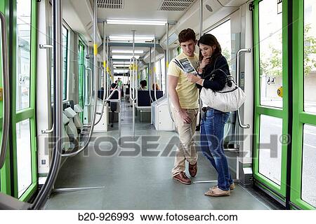 Young couple in tram, Vitoria, Alava, Basque Country, Spain View Large Photo Image Stock Image - Young couple in tram, Vitoria, Alava, Basque Country, Spain. Fotosearch
