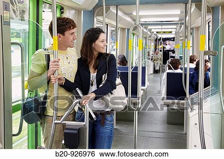 Stock Photograph - Young couple in tram, Vitoria, Alava, Basque Country, Spain. Fotosearch
