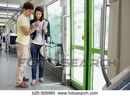 Stock Photography - Young couple in tram, Vitoria, Alava, Basque Country, Spain. Fotosearch