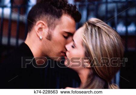 young couple kissing View Large Photo Image Stock Image - young couple kissing. Fotosearch