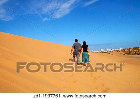 Young couple look and search for new home, house or apartment outside the big city. View Large Photo Image Stock Image - Young couple look and search for new home, house or apartment outside the big city.. Fotosearch