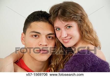 Stock Photograph - Young couple looking at the camera. Fotosearch