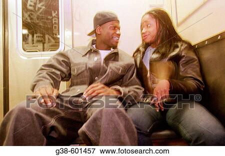 Young couple, New York subway train View Large Photo Image Stock Photo - Young couple, New York subway train. Fotosearch