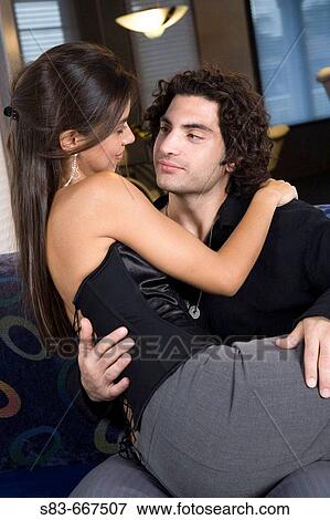 Young couple on couch in club. View Large Photo Image Stock Photo - Young couple on couch in club.. Fotosearch
