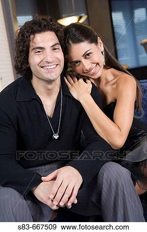 Young couple on couch in club. View Large Photo Image Stock Photo - Young couple on couch in club.. Fotosearch