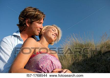 Picture - Young couple on the beach. Fotosearch