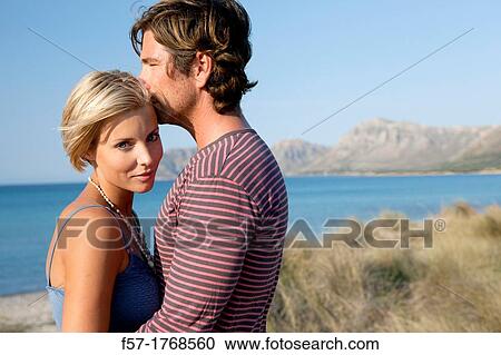 Young couple on the beach View Large Photo Image Stock Image - Young couple on the beach. Fotosearch