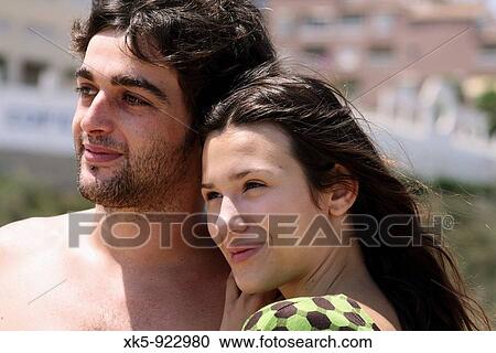 Young couple on the beach View Large Photo Image Stock Image - Young couple on the beach. Fotosearch
