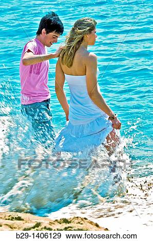 Young couple on the beach View Large Photo Image Stock Photo - Young couple on the beach. Fotosearch