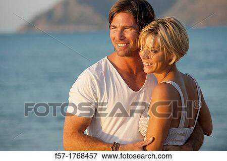 Young couple on the beach View Large Photo Image Stock Photo - Young couple on the beach. Fotosearch