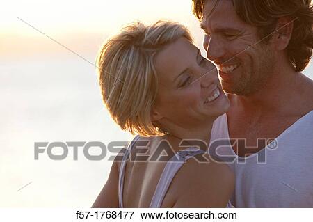 Young couple on the beach View Large Photo Image Stock Photo - Young couple on the beach. Fotosearch