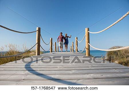 Young couple on the beach View Large Photo Image Stock Photo - Young couple on the beach. Fotosearch