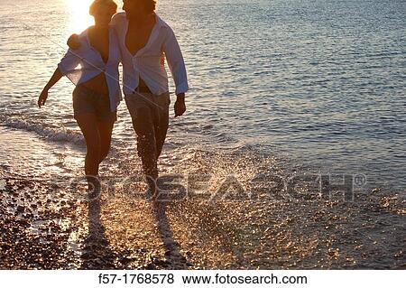 Young couple on the beach View Large Photo Image Stock Photo - Young couple on the beach. Fotosearch
