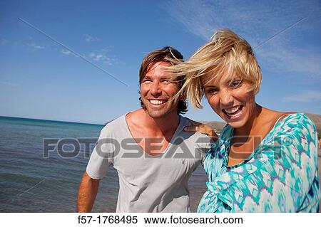 Young couple on the beach View Large Photo Image Stock Photography - Young couple on the beach. Fotosearch