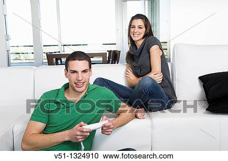 Young couple playing video games View Large Photo Image Stock Image - Young couple playing video games. Fotosearch