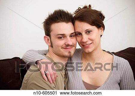Young couple posing together. View Large Photo Image Stock Image - Young couple posing together.. Fotosearch