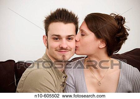 Young couple posing together. View Large Photo Image Stock Image - Young couple posing together.. Fotosearch