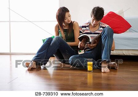 young couple reading book View Large Photo Image Stock Image - young couple reading book. Fotosearch