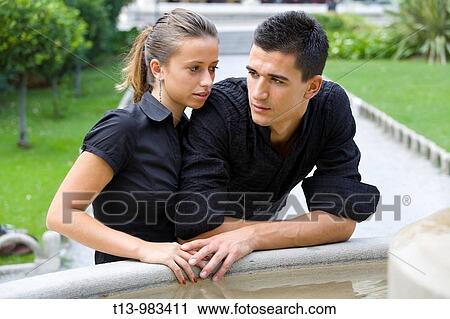 Young couple sentimental in park View Large Photo Image Stock Image - Young couple sentimental in park. Fotosearch