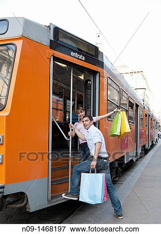 Stock Photo - young couple shopping in Milan. Fotosearch