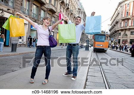 Young couple shopping in Milan View Large Photo Image Stock Photograph - Young couple shopping in Milan. Fotosearch