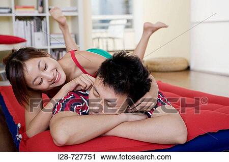 Stock Image - young couple sleeping on bed, close_up. Fotosearch