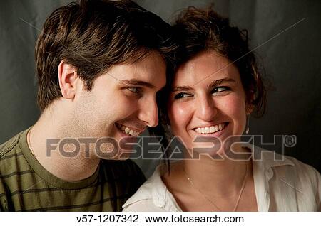 Young couple smiling Close view View Large Photo Image Stock Image - Young couple smiling Close view. Fotosearch