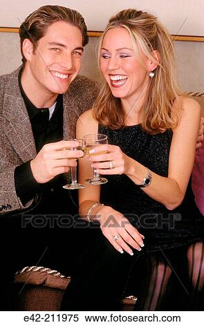 Stock Photography - Young couple toasting.. Fotosearch
