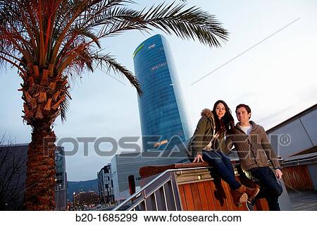 Young couple, Tourists, Iberdrola Tower, Padre Arrupe Bridge, Abandoibarra, Bilbao, Bizkaia, Basque Country, Spain View Large Photo Image Stock Photo - Young couple, Tourists, Iberdrola Tower, Padre Arrupe Bridge, Abandoibarra, Bilbao, Bizkaia, Basque Country, Spain. Fotosearch