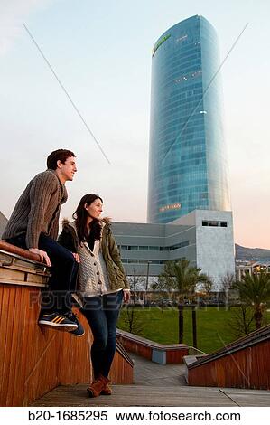 Young couple, Tourists, Iberdrola Tower, Padre Arrupe Bridge, Abandoibarra, Bilbao, Bizkaia, Basque Country, Spain View Large Photo Image Stock Photography - Young couple, Tourists, Iberdrola Tower, Padre Arrupe Bridge, Abandoibarra, Bilbao, Bizkaia, Basque Country, Spain. Fotosearch