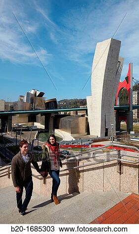Young couple visiting the city, Guggenheim Museum, Abandoibarra, Bilbao, Bizkaia, Basque Country, Spain View Large Photo Image Stock Image - Young couple visiting the city, Guggenheim Museum, Abandoibarra, Bilbao, Bizkaia, Basque Country, Spain. Fotosearch