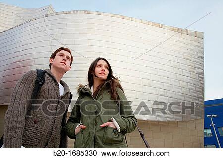 Young couple visiting the city, Guggenheim Museum, Abandoibarra, Bilbao, Bizkaia, Basque Country, Spain View Large Photo Image Stock Image - Young couple visiting the city, Guggenheim Museum, Abandoibarra, Bilbao, Bizkaia, Basque Country, Spain. Fotosearch