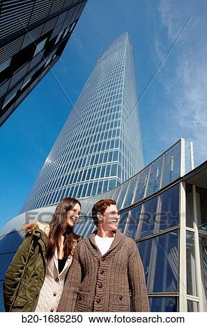 Young couple walking, Iberdrola Tower, Padre Arrupe Bridge, Abandoibarra, Bilbao, Bizkaia, Basque Country, Spain View Large Photo Image Stock Image - Young couple walking, Iberdrola Tower, Padre Arrupe Bridge, Abandoibarra, Bilbao, Bizkaia, Basque Country, Spain. Fotosearch