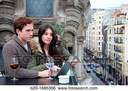 Young couple with digital tablet, digital tablet, Urban terrace bar, Alhondiga building, leisure and culture center, Bilbao, Bizkaia, Basque Country, Spain View Large Photo Image Stock Photograph - Young couple with digital tablet, digital tablet, Urban terrace bar, Alhondiga building, leisure and culture center, Bilbao, Bizkaia, Basque Country, Spain. Fotosearch
