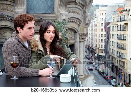 Young couple with digital tablet, digital tablet, Urban terrace bar, Alhondiga building, leisure and culture center, Bilbao, Bizkaia, Basque Country, Spain View Large Photo Image Stock Photography - Young couple with digital tablet, digital tablet, Urban terrace bar, Alhondiga building, leisure and culture center, Bilbao, Bizkaia, Basque Country, Spain. Fotosearch