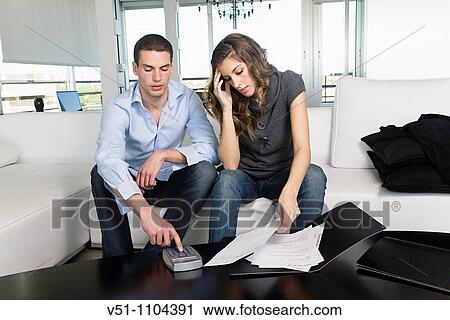 Young couple with financial stress View Large Photo Image Stock Image - Young couple with financial stress. Fotosearch