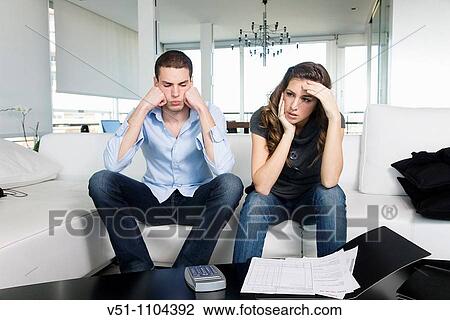 Young couple with financial stress View Large Photo Image Stock Image - Young couple with financial stress. Fotosearch
