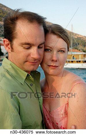 Young Couple with Ocean as background View Large Photo Image Stock Photography - Young Couple with Ocean as background. Fotosearch