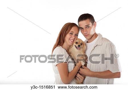 Young couple with pomeranian dog View Large Photo Image Stock Image - Young couple with pomeranian dog. Fotosearch