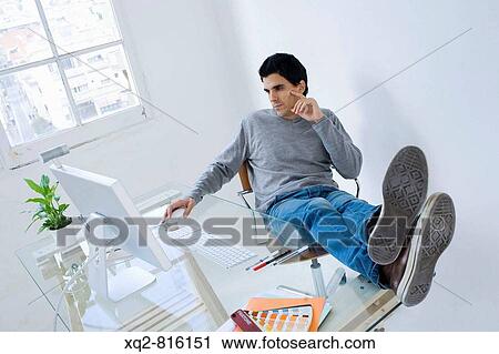 Young creative at office View Large Photo Image Stock Image - Young creative at office. Fotosearch
