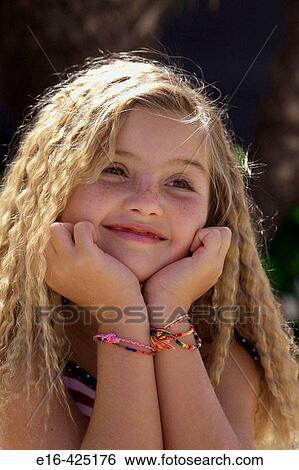 Young curly blonde smiling View Large Photo Image Stock Photograph - Young curly blonde smiling. Fotosearch