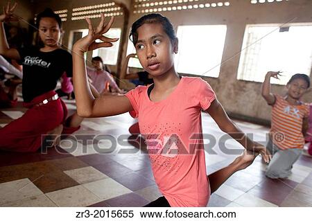 Stock Photography - Young dancers practice traditional Cambodian dance which they perform at the National Museum in Phnom Penh, Cambodia.. Fotosearch