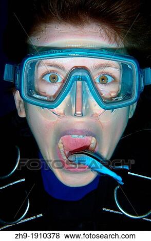 Young diver having mouth cleaned by cleanerfish, Sabre-toothed blenny Aspidontus taeniatus, Red Sea, Egypt, Africa View Large Photo Image Stock Photo - Young diver having mouth cleaned by cleanerfish, Sabre-toothed blenny Aspidontus taeniatus, Red Sea, Egypt, Africa. Fotosearch