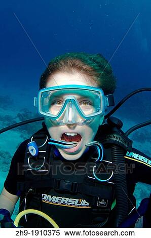 Young diver having mouth cleaned by cleanerfish, Sabre-toothed blenny Aspidontus taeniatus, Red Sea, Egypt, Africa View Large Photo Image Stock Photography - Young diver having mouth cleaned by cleanerfish, Sabre-toothed blenny Aspidontus taeniatus, Red Sea, Egypt, Africa. Fotosearch