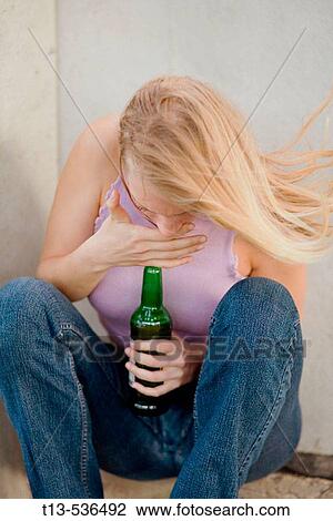 Young drunk blonde woman is going to disgorge after drinking beer View Large Photo Image Stock Image - Young drunk blonde woman is going to disgorge after drinking beer. Fotosearch
