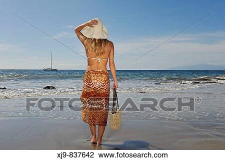 Young elegant lady waiting a sailboat in Tenerife south beach. View Large Photo Image Stock Image - Young elegant lady waiting a sailboat in Tenerife south beach.. Fotosearch