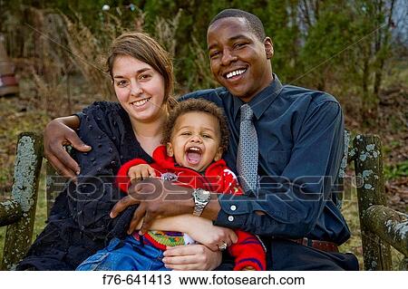 Young family. Caucasian mother and African (Kenyan) father with their 18 month old son. View Large Photo Image Stock Image - Young family. Caucasian mother and African (Kenyan) father with their 18 month old son.. Fotosearch