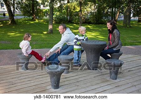 Young Family Sitting in Park, Chess Grounds in P? rnu Rannapark, Estonia, Europe View Large Photo Image Stock Image - Young Family Sitting in Park, Chess Grounds in P? rnu Rannapark, Estonia, Europe. Fotosearch